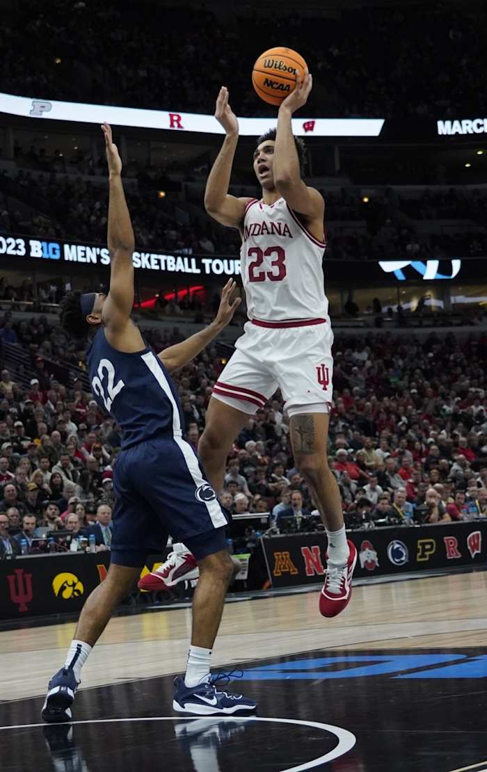 Trayce Jackson-Davis (23) is defended by Penn State Nittany Lions guard Jalen Pickett (22) during the first half at United Center.